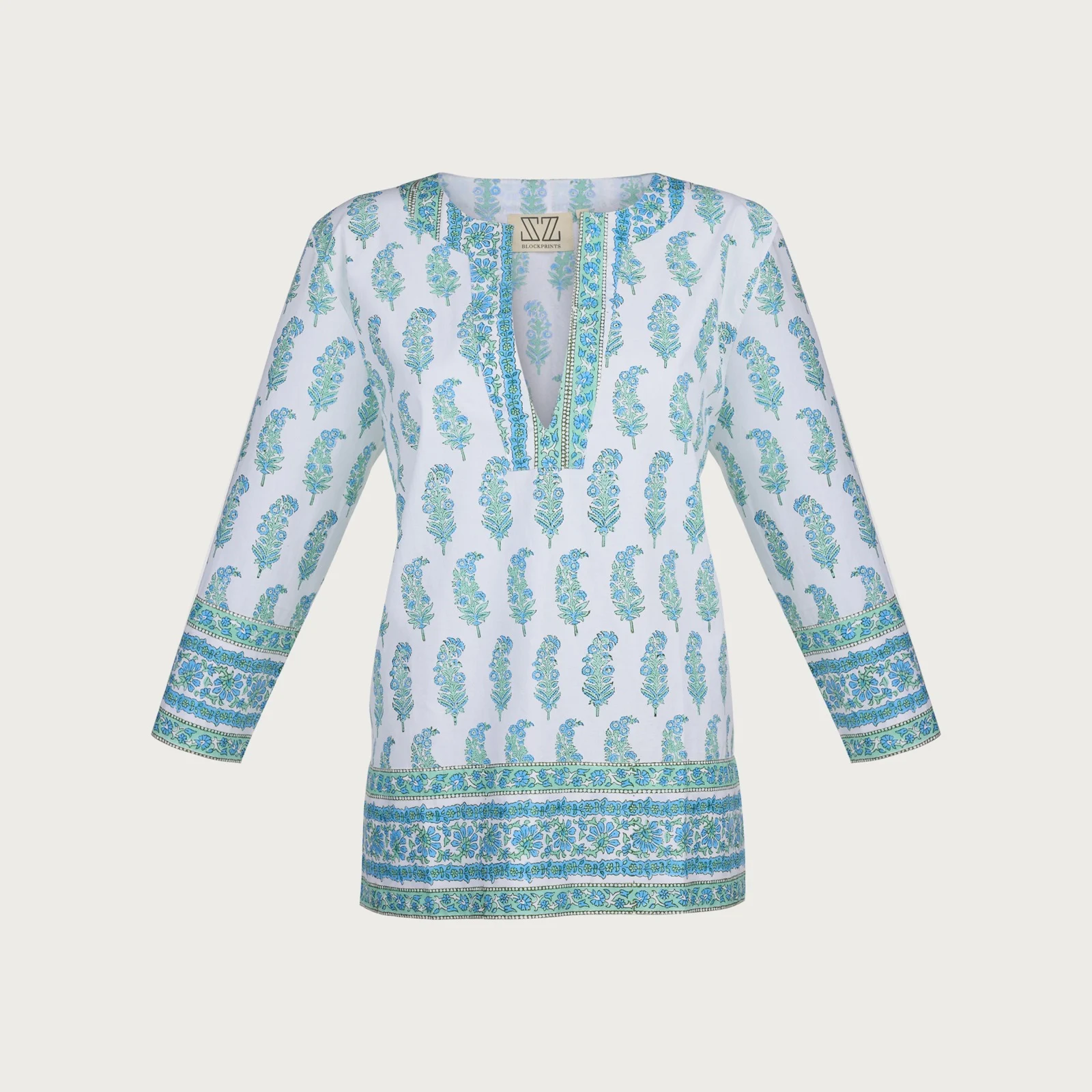 E-commerce product photograph of folded clothing and textile detail